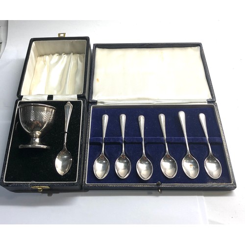 76 - Boxed set of silver tea spoons and a boxed egg cup and spoon Birmingham silver hallmarks worn