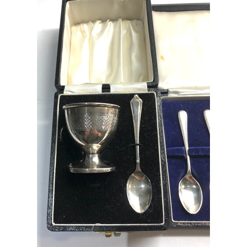 76 - Boxed set of silver tea spoons and a boxed egg cup and spoon Birmingham silver hallmarks worn