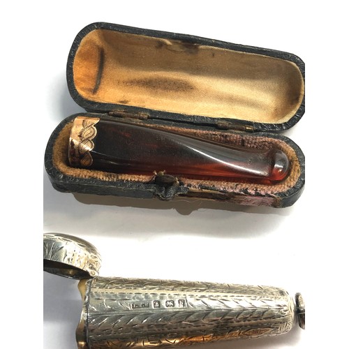 432 - 2 gold mounted amber cheroot holders cased n silver and leather cases age related wear and damage