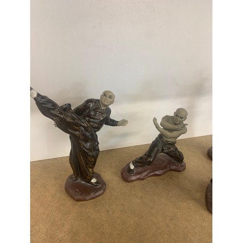 65 - 4 Oriental fighting figures, all in good overall condition