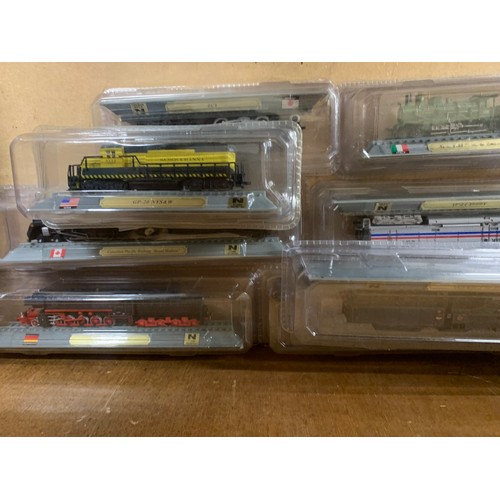 66 - Selection of 14 Del Prado train models, all in original plastic packaging