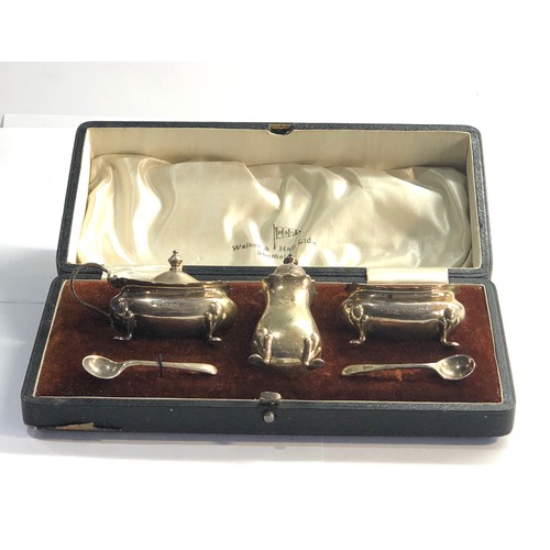 11 - Boxed silver walker and hall cruet set with blue glass liners