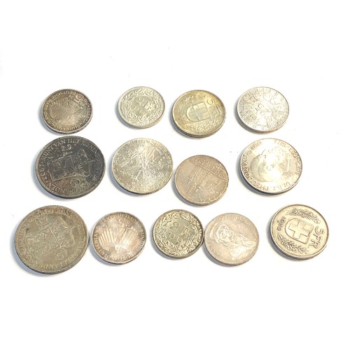 309 - Selection of foreign silver coins 200g