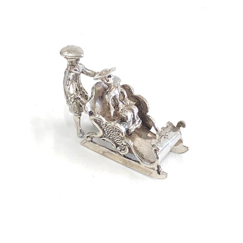 104 - Dutch silver miniature lady in sledge dutch sword hallmark