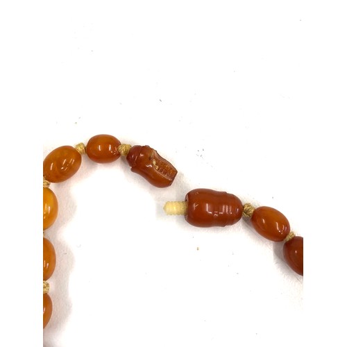 190 - Antique egg yolk amber bead necklace weight 14g