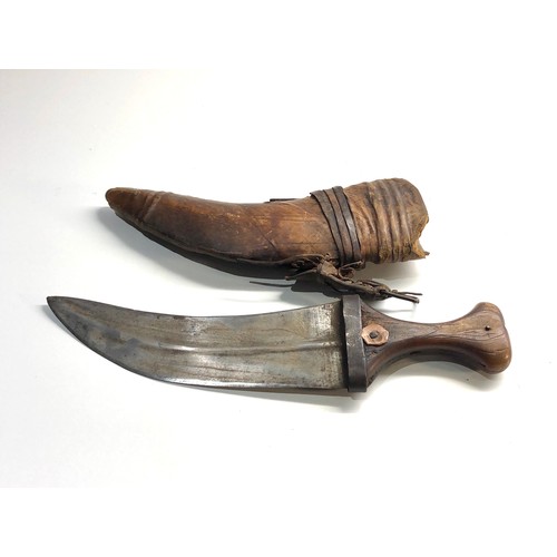 335 - 19th century Arab Rhino horn hilted Jambiya dagger and a leather hawks head cover