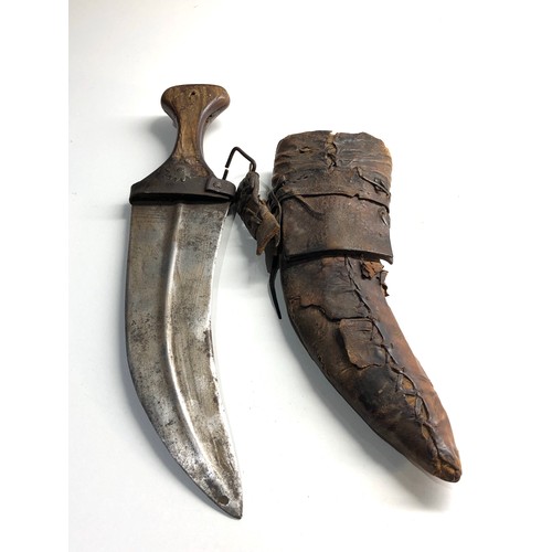 335 - 19th century Arab Rhino horn hilted Jambiya dagger and a leather hawks head cover