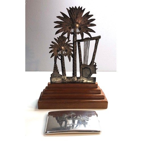 343 - An Iraqi neillo and silver palm tree on a wooden base with another similar large cigarette case