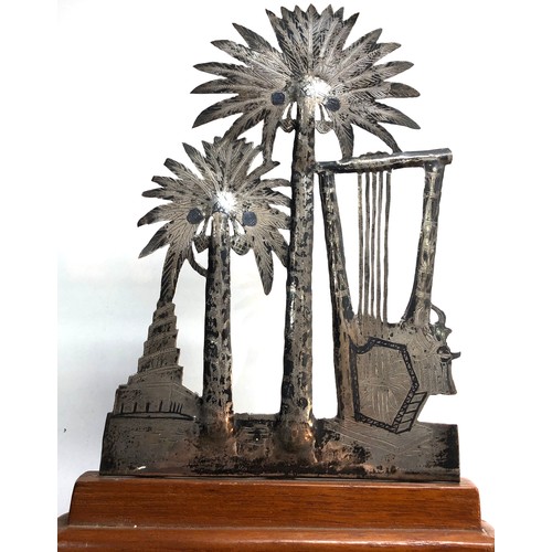 343 - An Iraqi neillo and silver palm tree on a wooden base with another similar large cigarette case