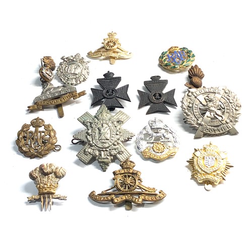 314 - Selection of miitary cap badges etc