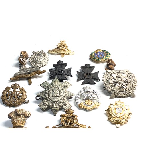 314 - Selection of miitary cap badges etc