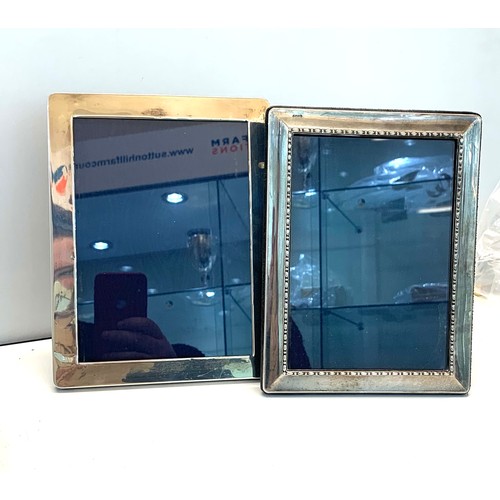 93 - 2 Vintage silver picture frames 21cm by 16cm