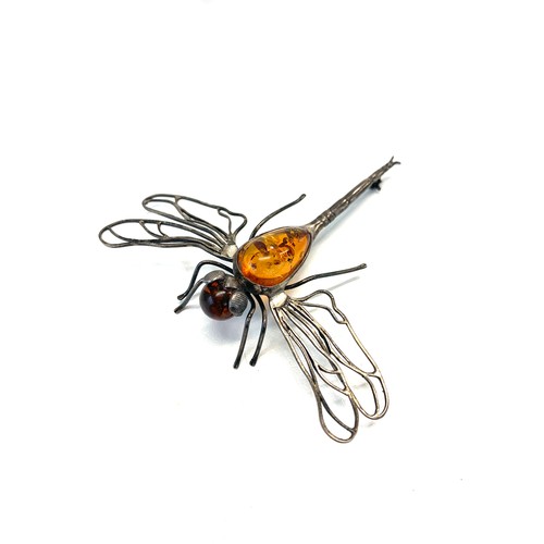 142 - Silver and amber dragon fly brooch