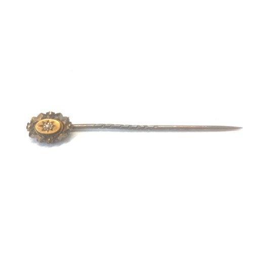 121 - Small 15ct gold diamond stick pin