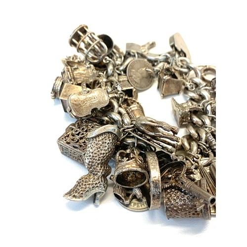 135 - Huge vintage silver charm bracelet and charms