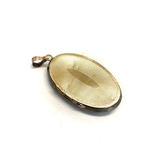 128 - Vintage silver and gold back locket