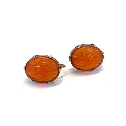 211 - Silver and gold carved carnelian earrings