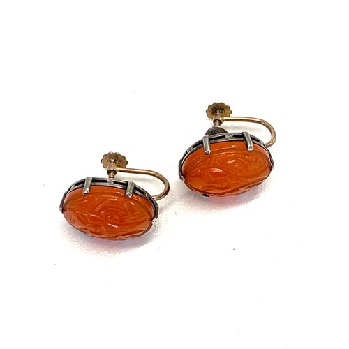 211 - Silver and gold carved carnelian earrings