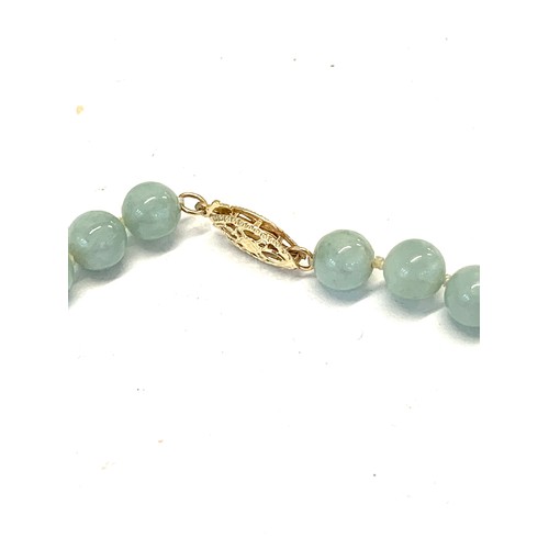 194 - 14ct Gold clasp Jade necklace and pendant