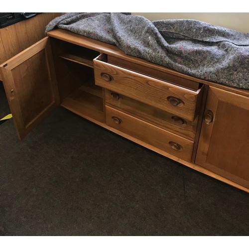 377 - Vintage 2 door 3 draw teak Ercol Sideboard measures approx 61ins height 27ins