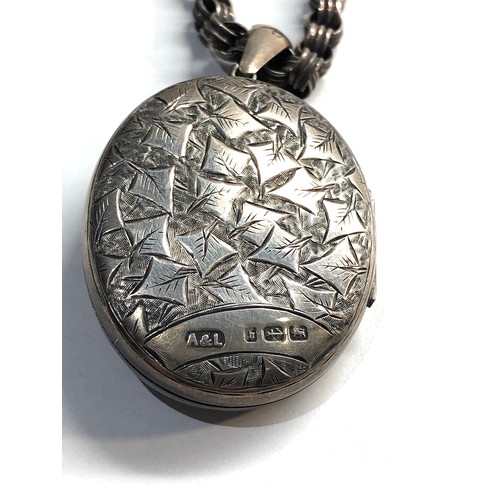 83 - Antique silver locket and chain, Good overall condition, clasp at top of pendant will need alit repa... 