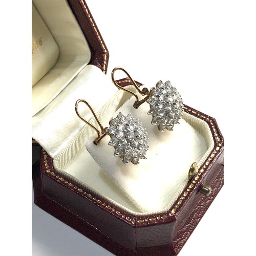 152 - 9ct cz cluster earrings