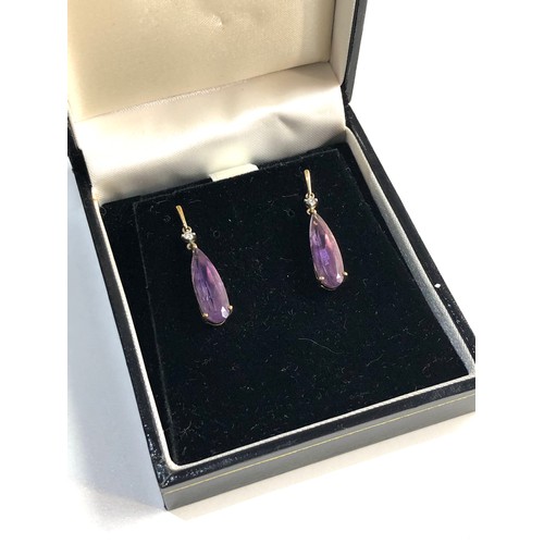 172 - 9ct Gold amethyst and diamond accent drop earring,