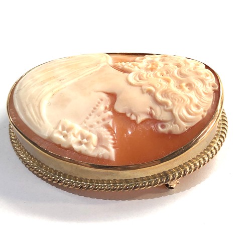 32 - Large gold framed cameo brooch measures approx53mm by 43mm total weight 16g