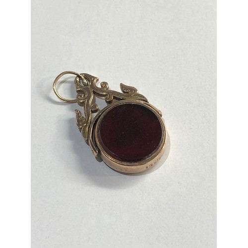 176 - 9ct Gold agate spinning fob, weight approx 2g, Age related wear, some very small chips to stone