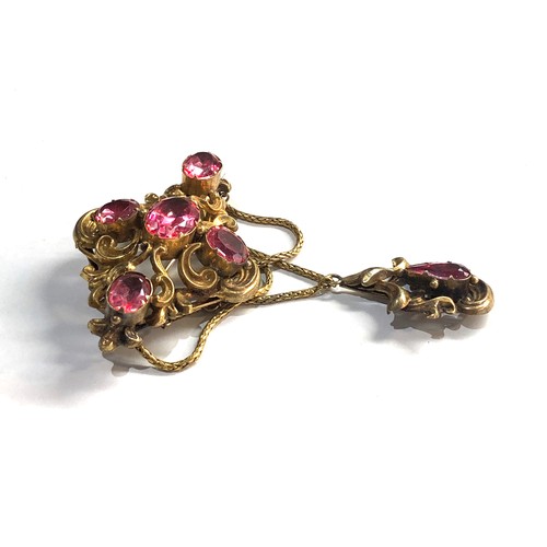 163 - hi-carat gold foil back pink stone brooch measures approx 75mm drop 53mm wide not hallmarked but xrt... 