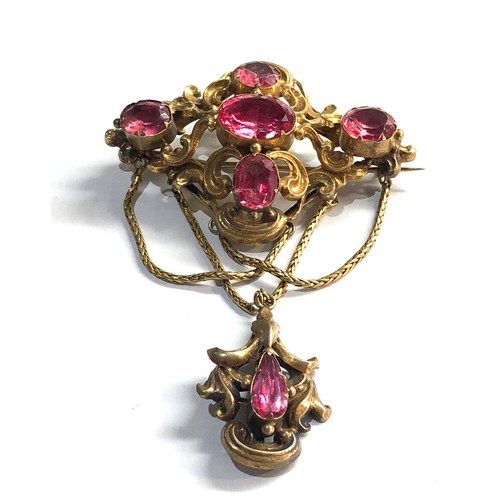 163 - hi-carat gold foil back pink stone brooch measures approx 75mm drop 53mm wide not hallmarked but xrt... 