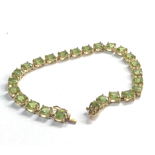 225 - 9ct gold green gemstone bracelet