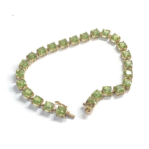 225 - 9ct gold green gemstone bracelet