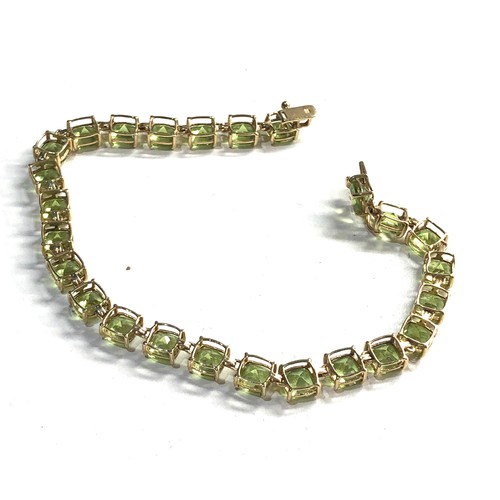 225 - 9ct gold green gemstone bracelet