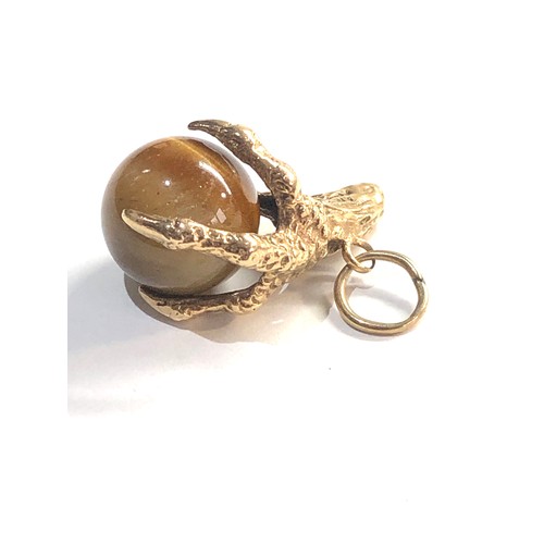 9ct Gold tigers eye eagle claw charm/ pendant, this piece is in good  overall condition