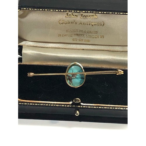 128 - 9ct gold turquoise bar brooch