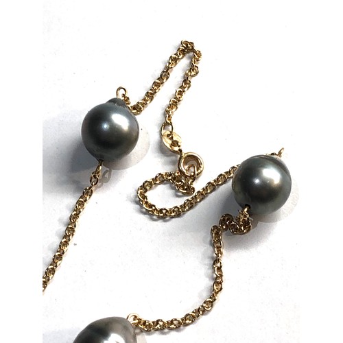 21 - 18ct gold black pearl necklace