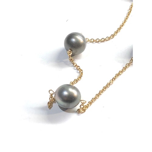 21 - 18ct gold black pearl necklace