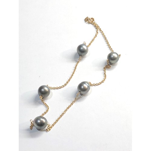 21 - 18ct gold black pearl necklace