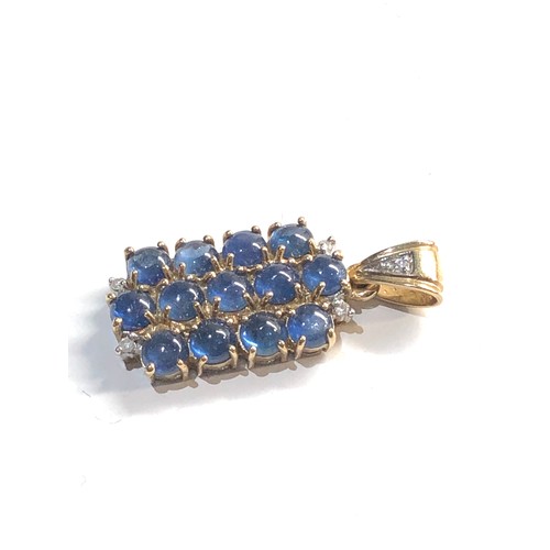 284 - 9ct gold sapphire star pendant