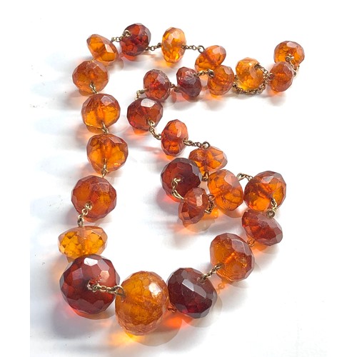 273 - 9ct gold chain faceted amber bead necklace