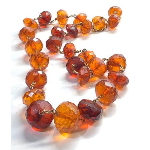 273 - 9ct gold chain faceted amber bead necklace