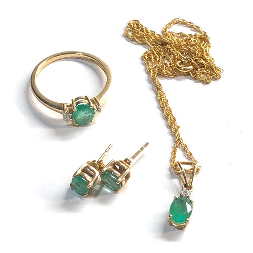 135 - 9ct gold emerald pendant , earrings and ring