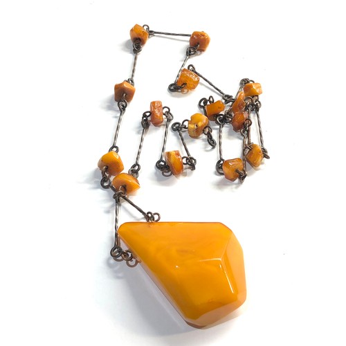 61 - large egg yolk amber pendant and  amber bead necklace