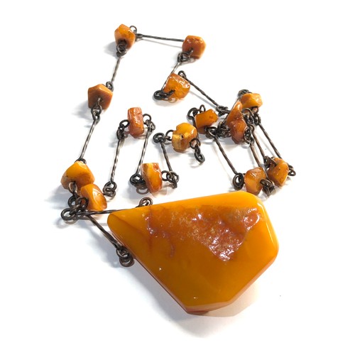 61 - large egg yolk amber pendant and  amber bead necklace