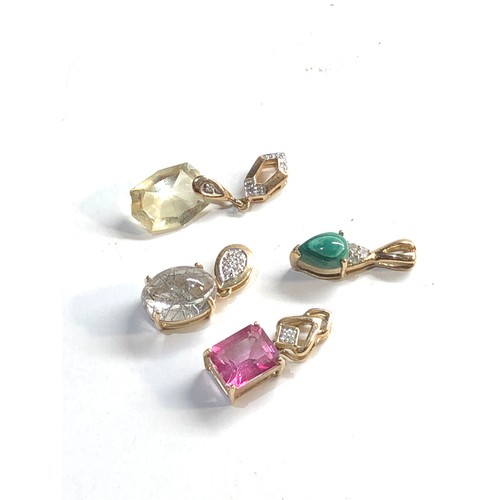 115 - 4 9ct gold gem set pendants