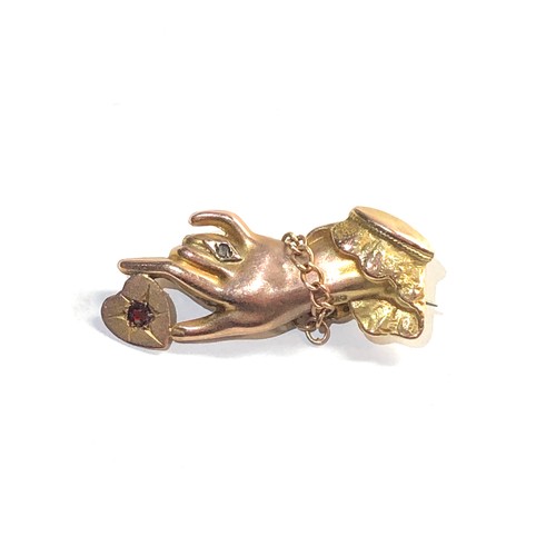 121 - 9ct gold hand brooch