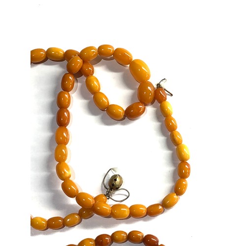 304 - 2 egg yolk amber bead necklaces 26g