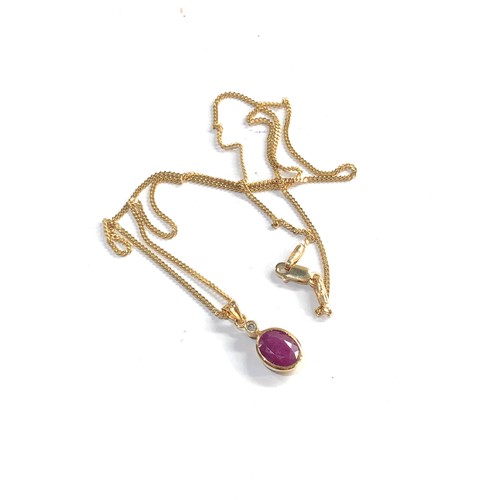 226 - 14ct gold chain and 18ct gold and ruby diamond pendant