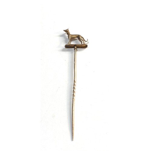 20 - high carat  Gold greyhound stick pin measures approx 9.5cm long, his piece is in good overall condit... 